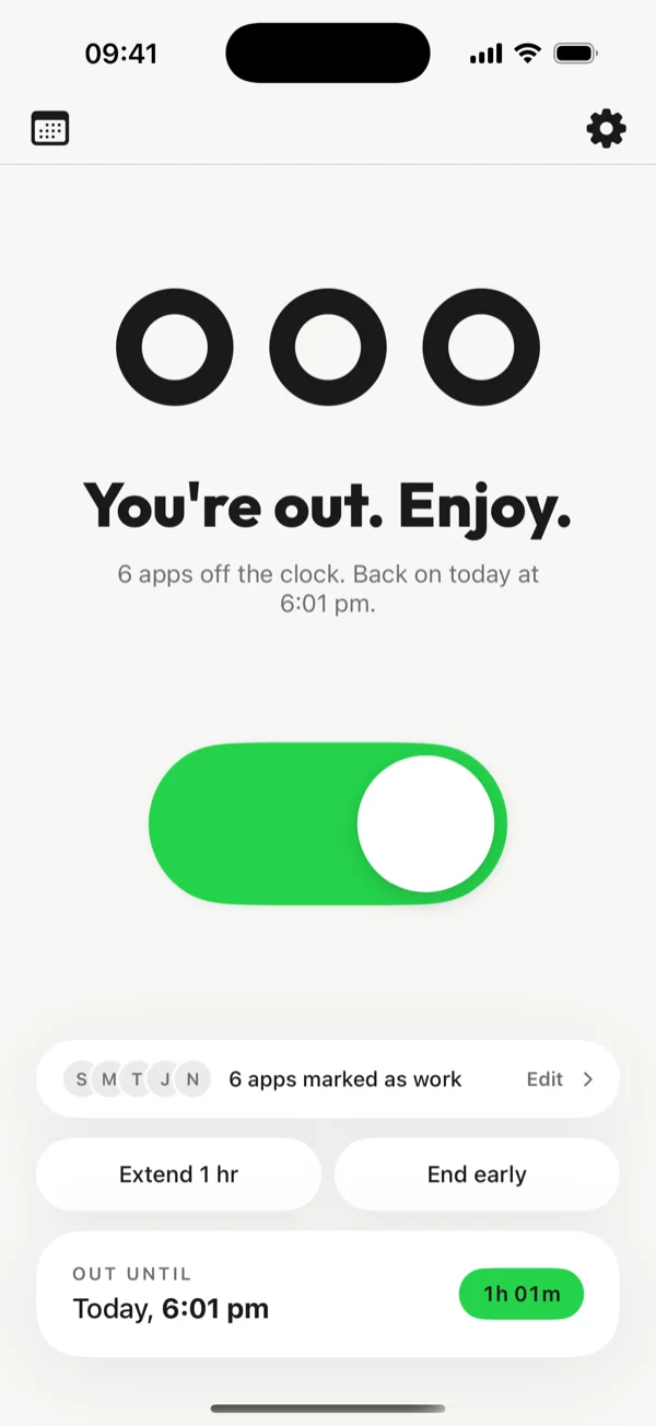 Home screen out of office: green toggle and the line You’re out. Enjoy.